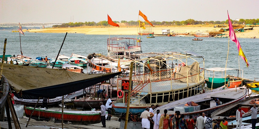 A glimpse of people and boats decked at the tranquil Dodda Ghosai Ghat, Karnataka.