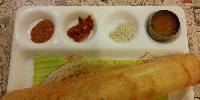 The best food in Tamil Nadu is crispy fermented rice crepe served with chutney and sambar.