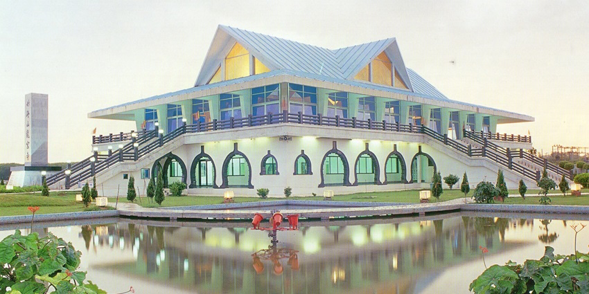 Majestic Dragon Palace Temple with intricate architecture and vibrant colours under blue sky.