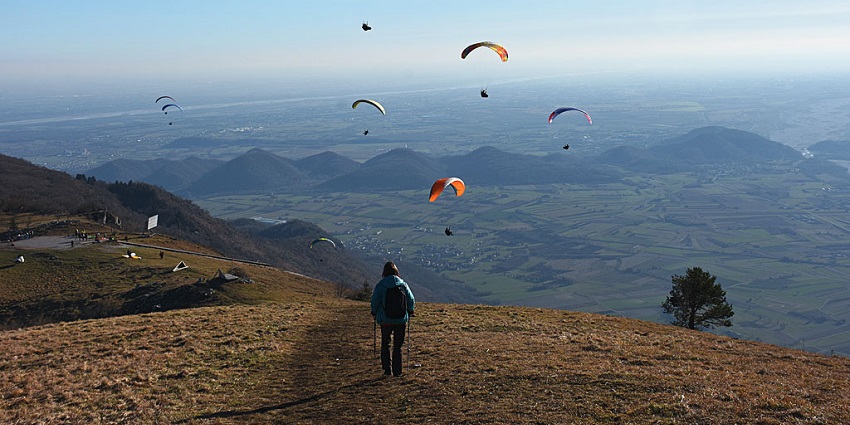 A scenic paragliding take-off spot at the mountains, surrounded by lush landscapes.