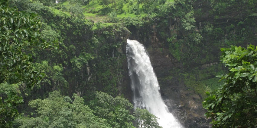 Tourists capture the breathtaking view of Dugarwadi Waterfall near Nashik, Maharashtra