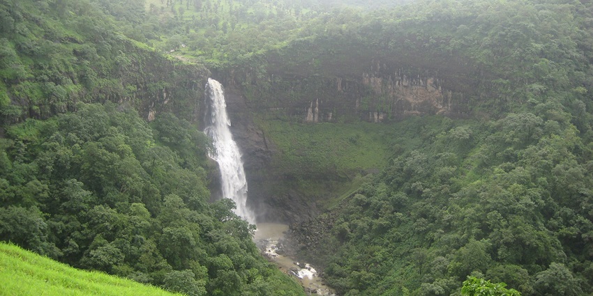 One of the places to visit in Nashik is Dugarwadi Waterfall surrounded by lush green hills.