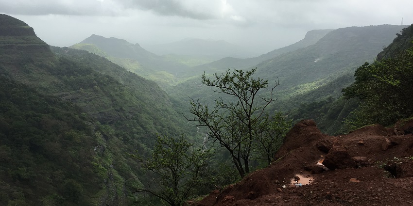 A picture of a cliffside, exploring thrilling trekkers Duke's Nose peak that looks like a nose