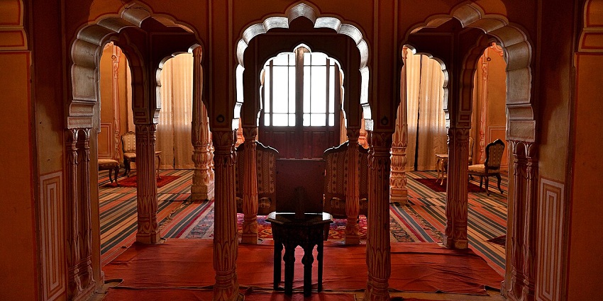 Diwan Khana at Shivgarh Fort, featuring traditional architecture and designed chairs.