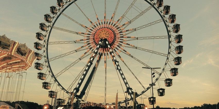 View of a large ferris wheel, capturing excitement and fun of the adventure park