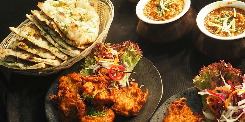 An image of a beautifully arranged platter of dishes at Grapewine, showcasing vibrant colours.