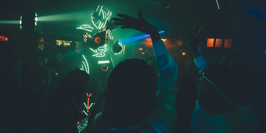 People dancing at to the techno beats in Electro universe