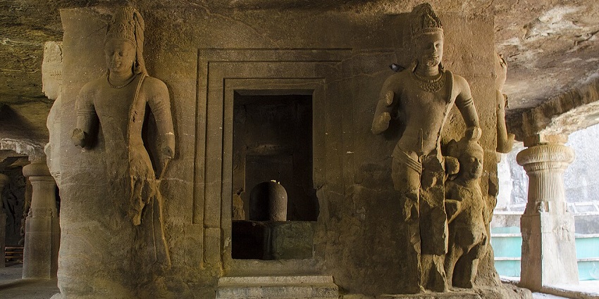 Idols and carvings inside the halls of Elephanta Caves offering an insight into cultural heritage.