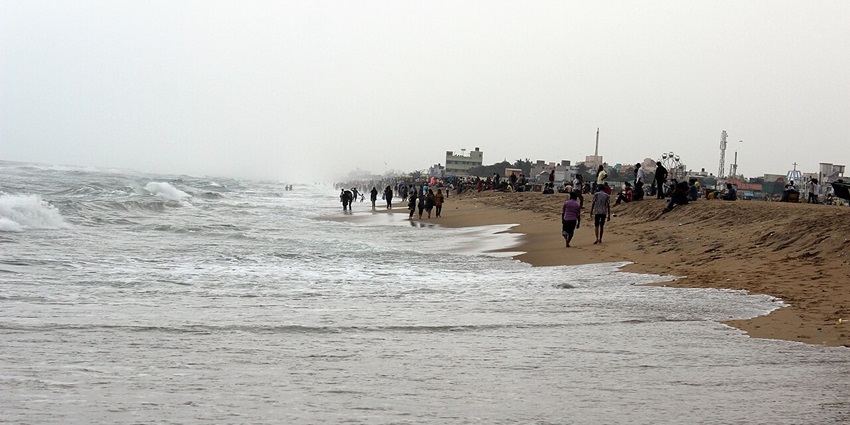 Elliot’s Beach with golden sands, Karl Schmidt Memorial, and serene sea views in Besant Nagar, situated near Dinosaur Museum, Chennai.