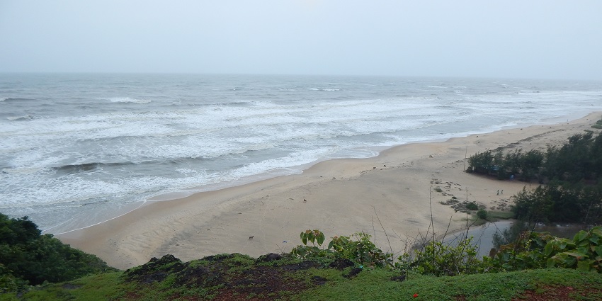 Apsarakonda Beach, a tranquil beach with golden sands and palm-lined shores.