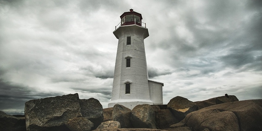 A view of the Lighthouse, surrounded by rocks - one of the things to do in Honnavar.