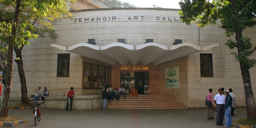 Visitors admiring the contemporary artworks and collections at Jehangir Art Gallery