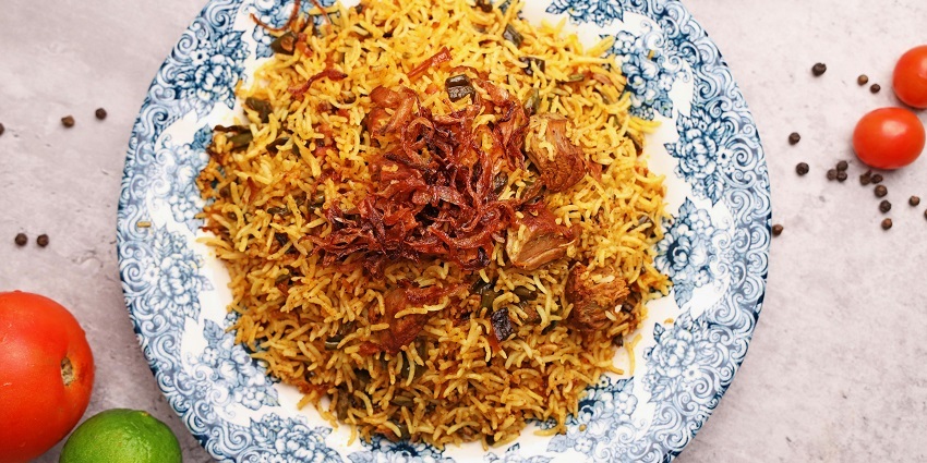 An image of the plate of aromatic biryani served at Zam Zam restaurant, among the best things to do in Bhopal