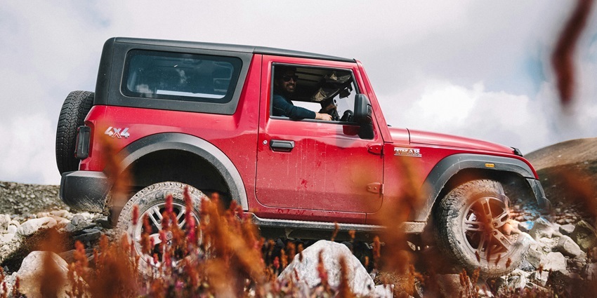 Image of a man off-road on jeep safari - one of the best things to do in Kodagu