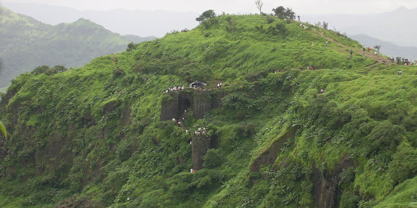 A trek to Sinhagad Fort offers breathtaking views of the Sahyadri mountains and greenery.