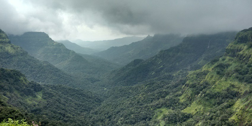 Enjoy the scenic views of Sahyadri hills from the Jyotiba temple courtyard