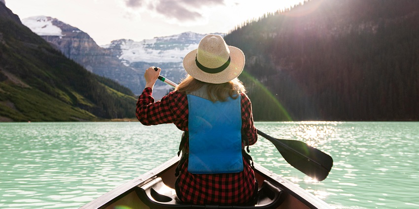 An image of a canoeist paddling on the calm waters of the Denwa River, near the park.