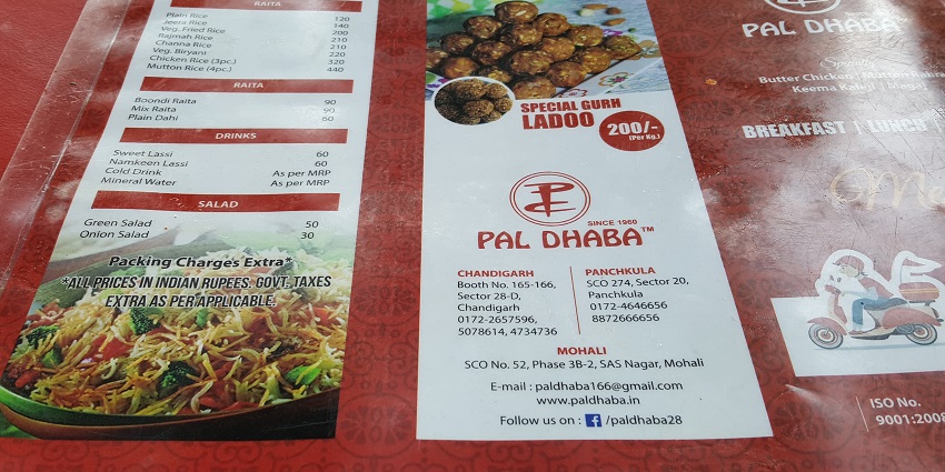 A platter of traditional food at Pal Dhaba, highlighting the things to do in Chandigarh at night.