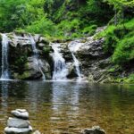 A glimpse of shimmering waters cascading through the rustic cliffs of Tamil Nadu.