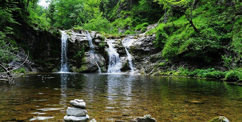 A glimpse of shimmering waters cascading through the rustic cliffs of Tamil Nadu.