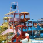 A view of a water park in Mumbai with adventurous rides and pool during the daytime.