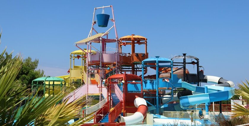 A view of a water park in Mumbai with adventurous rides and pool during the daytime.