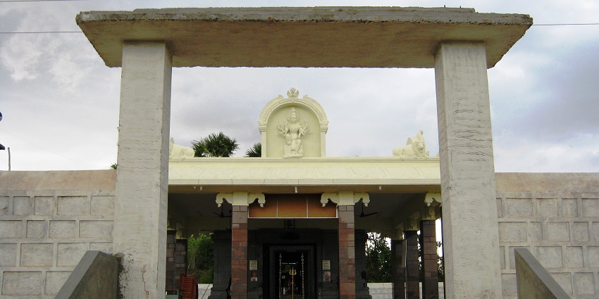 An image of the Ettukai Amman Temple, adorned with colourful decorations during a festival.