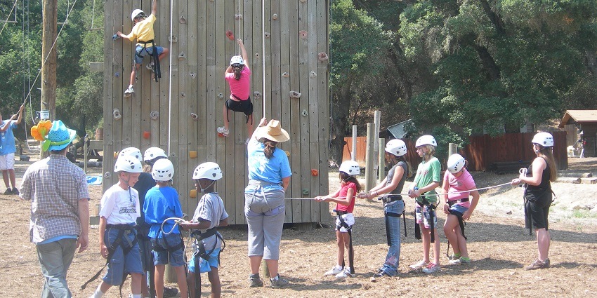 Image of children climbers on a rock wall at an outdoor facility in Navi Mumbai