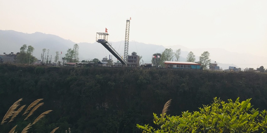 Adventurer preparing to leap during a bungee jump.