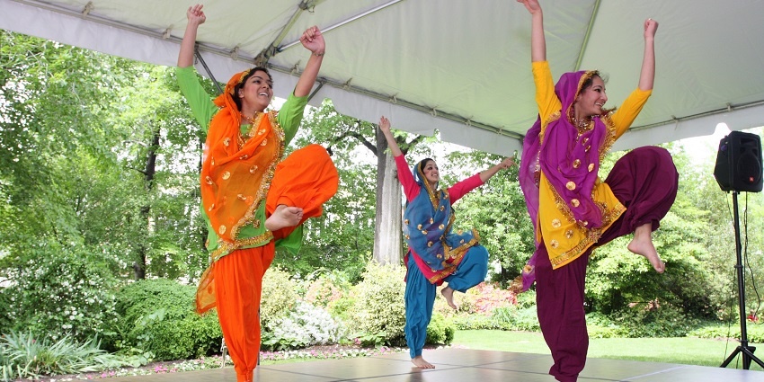 A group performing the Bhangra dance, which is one of the top things to do in Punjab.