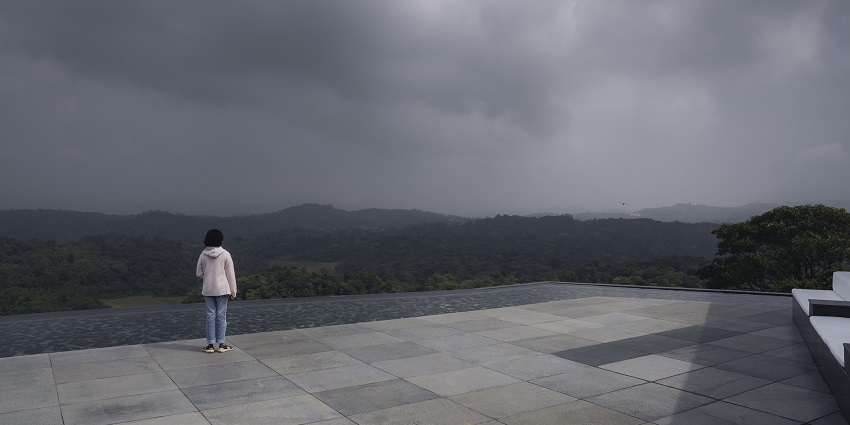 A scenic view of Coorg, with green hills, misty skies, one of the best things to see in Karnataka.