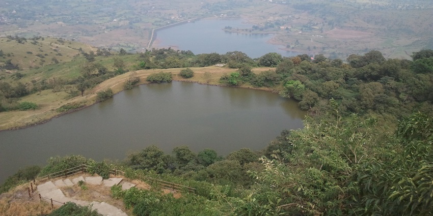 Serene view of Hanuman Lake, a peaceful spot for nature walks and birdwatching.