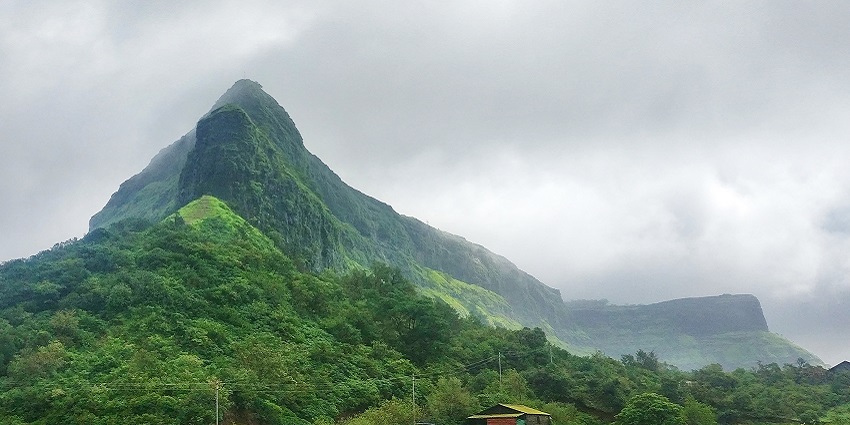 An image of trekkers enjoying the natural beauty during trekking amidst the ruins.