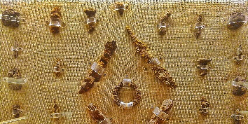 Different types of iron objects from the historical period, displayed in the Ahar museum.