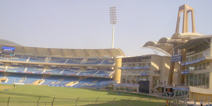 DYPatil Stadium has a vast field and seating areas filled with spectators