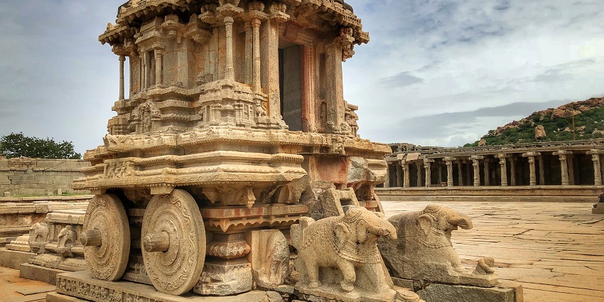 Hampi, among the famous tourist places in Ballari, features ancient ruins, and landscapes.