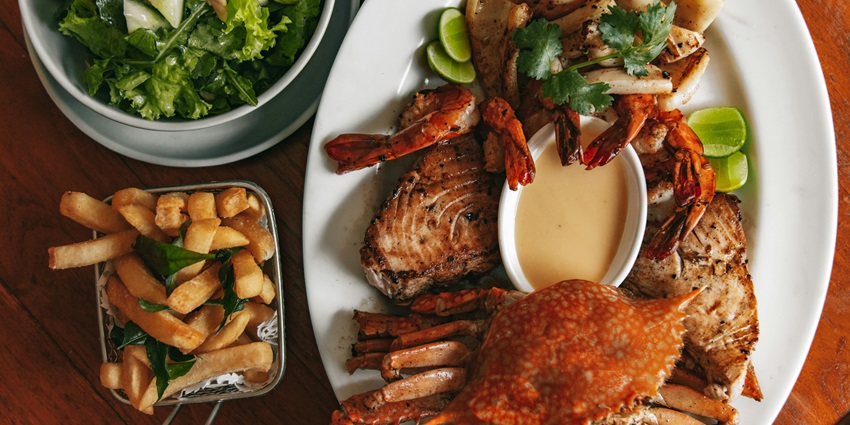 Delicious seafood served on a ceramic plate at a coastal restaurant