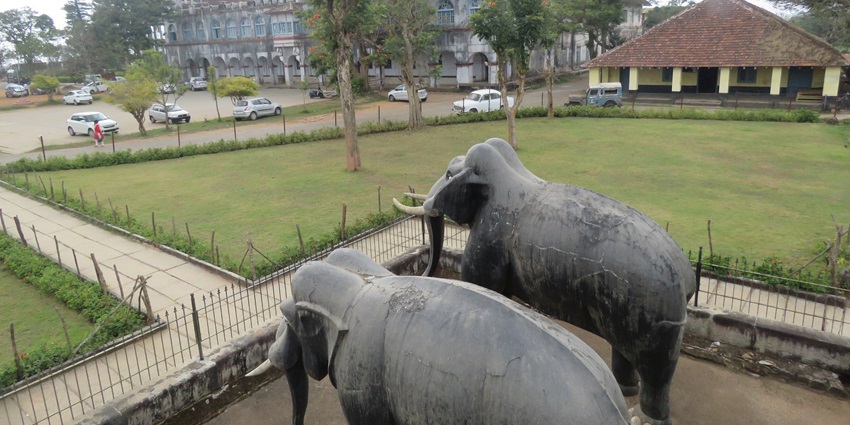 An image of the Madikeri Fort, with two life-size elephants statue, things to do in Coorg