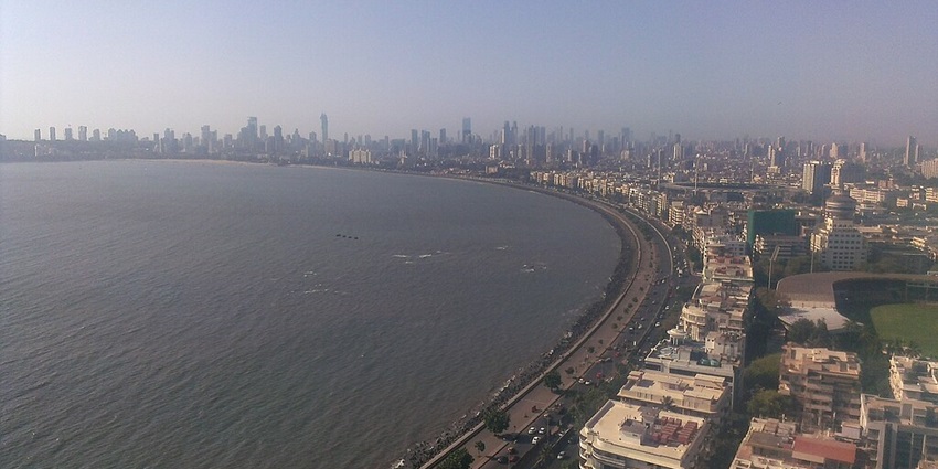 Scenic view of Marine Drive in Mumbai at night, lightened up by streetlights.