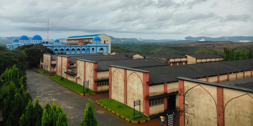 An aerial picture of a college campus in Bhatkal Town, taken on a cloudy day