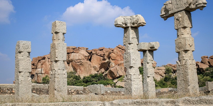 Hampi showcasing ancient temples and structures surrounded by boulders and rocks.