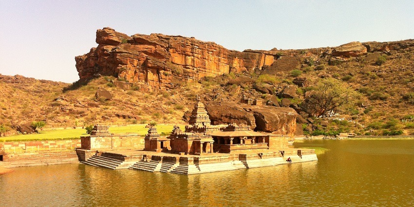 Ancient rock-cut temples in Badami showcasing historical architecture.
