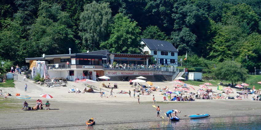 Distant view of a beach club offering relaxation, drinks, and a lively atmosphere