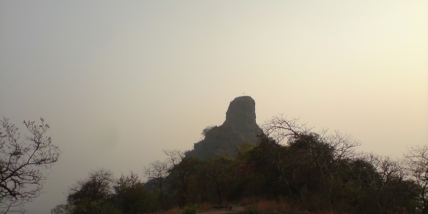 An image of trekkers exploring Karnala fort, showcasing famous trekking forts in Karnala.