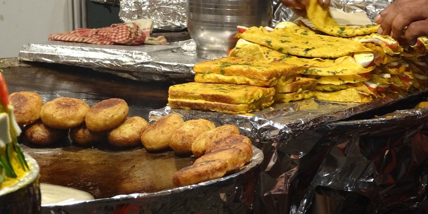 colorful street food stalls, a popular tourist attraction near Mumbai, with traditional snacks.