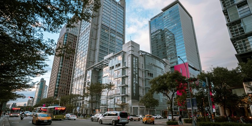 The huge building similar to the ones near Fifth Avenue in UB City.