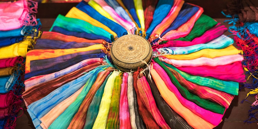 A busy silk cocoon workplace similar to the famous Silk cocoon market of Ramanagara.