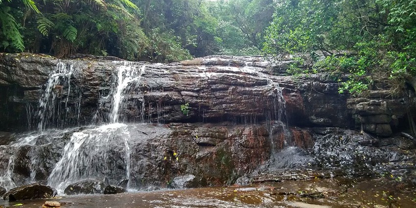 Long exposure photo of one of the biggest waterfalls in Kodaikanal flowing down rocks