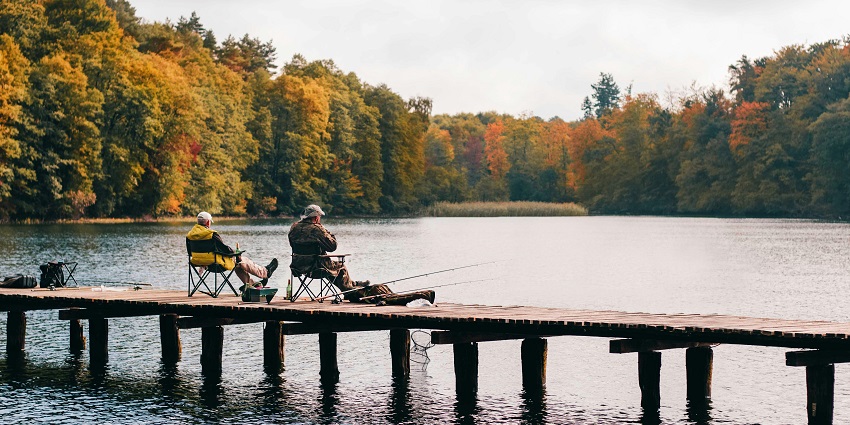 An image of an angler peacefully fishing on Lavasa's lake, one of the top Lavasa water sports.