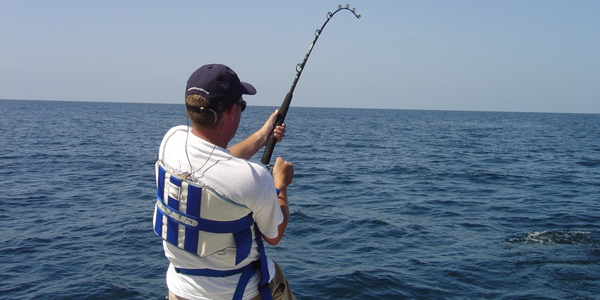 A picture of a tourist fishing in the sea around the Shrivardhan Beach in Shrivardhan